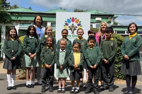Headteacher Kristal Brookes, Deputy Headteacher Lucia Wilder and children from Mere Green Primary School, which has received a glowing Ofsted report.