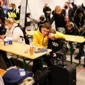 Young Ukrainian refugees rest after arriving at the main railway station in Berlin on Monday (Picture: Odd Andersen/AFP via Getty Images)