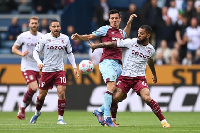 BURNLEY, ENGLAND - MAY 07: Jack Cork of Burnley battles for possession with Douglas Luiz of Aston Villa during the Premier League match between Burnley and Aston Villa at Turf Moor on May 07, 2022 in Burnley, England. (Photo by Gareth Copley/Getty Images)