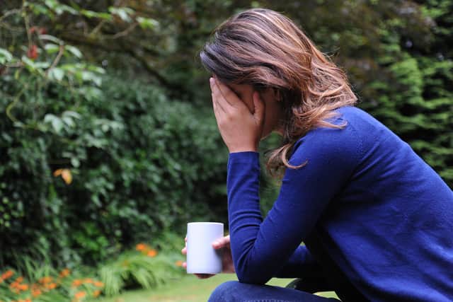 EMABRGOED TO 1600 THURSDAY APRIL 22 PICTURE POSED BY MODEL. File photo dated 31/07/14 of a woman showing signs of depression. There is an "urgent" need for research to help find the best way for people to stop using antidepressants, academics have said. Issue date: Thursday April 22, 2021.