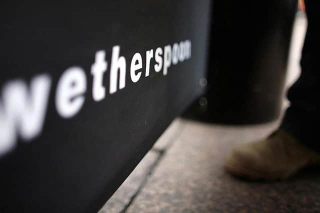 A man has claimed to have been removed from Wetherspoons while wearing a remembrance poppy
