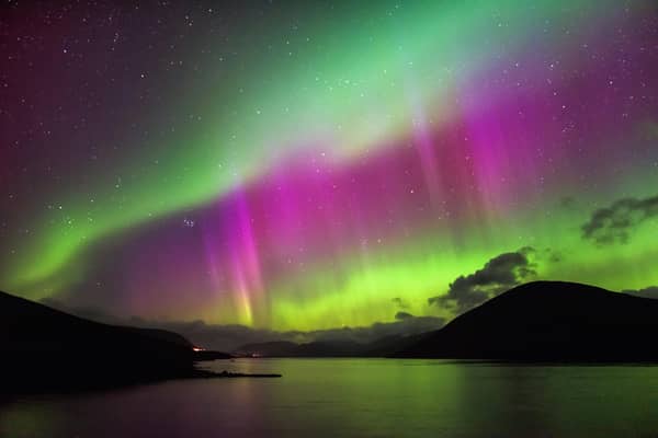 Aurora Borealis, also known as the Northern Lights, putting a show on dancing over Loch Glascarnoch, by Garve, in the Highlands