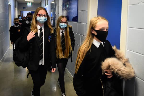 Under new guidance, pupils in Year 7 and above as well as visitors and staff, are being "strongly advised" to wear face masks in communal areas (Photo by ANDY BUCHANAN/Digital/AFP via Getty Images)