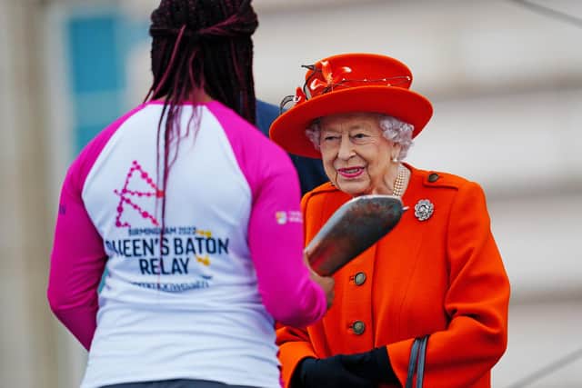 Kadeena Cox receiving the Baton from The Queen at the Queen's Baton Relay launch.