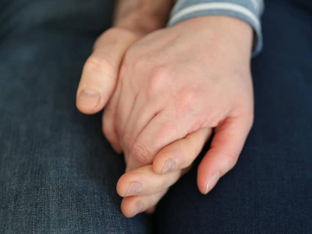 File photo dated 05/02/20 of a married couple holding hands, as couples could receive financial support from their partners if relationships break down, a report aimed at reforming the law for cohabiters in Scotland has suggested.