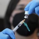 A registered nurse prepares a dose of a monkeypox vaccine  (AP Photo/Rick Bowmer, File)