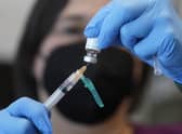 A registered nurse prepares a dose of a monkeypox vaccine  (AP Photo/Rick Bowmer, File)