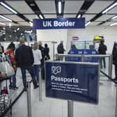 Border Force check the passports of passengers arriving. Photo: Getty Images