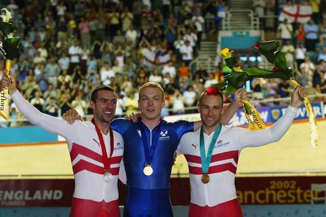 Jason Queally of England (Silver) Chris Hoy of Scotland (Gold) and Jamie Staff of England (Bronze) after the Men's 1000m time trail final at the National Cycling centre during the 2002 Commonwealth Games in Manchester, England on July 28, 2002. (Photo by Laurence Griffiths/Getty Images)