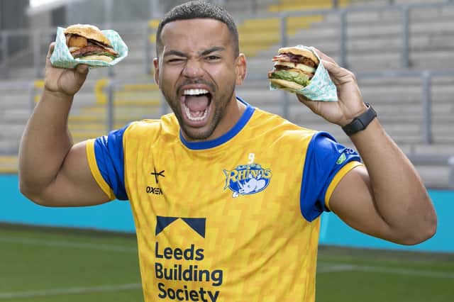 First men’s team captain of the Leeds Rhinos, Kruise Leeming, ‘try-s and tastes’ new Deliveroo x Hooyah Burgers exclusive Leeds Rhinos burger ahead of its launch on National Burger Day, August. 25 (photo: Doug Jackson/PinPep)