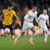 WOLVERHAMPTON, ENGLAND - MARCH 18: Raul Jimenez of Wolverhampton Wanderers is fouled by Pascal Struijk of Leeds United during the Premier League match between Wolverhampton Wanderers and Leeds United at Molineux on March 18, 2022 in Wolverhampton, England. (Photo by Laurence Griffiths/Getty Images)