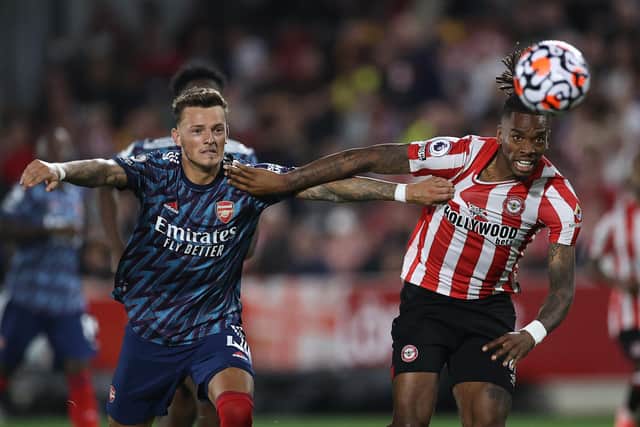 Ivan Toney of Brentford is challenged by Ben White of Arsenal during the Premier League match between Brentford  and  Arsenal at Brentford Community Stadium on August 13, 2021 in Brentford, England. (Photo by Eddie Keogh/Getty Images)