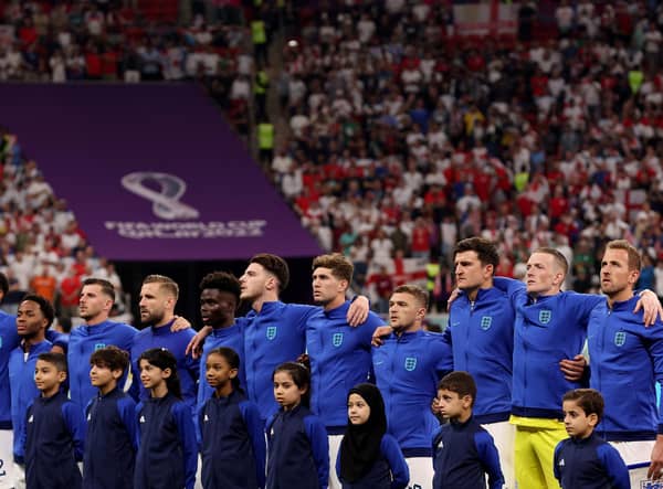 AL KHOR, QATAR - NOVEMBER 25: England stands for their national anthem before the match against the United States during the FIFA World Cup Qatar 2022 Group B match between England and USA at Al Bayt Stadium on November 25, 2022 in Al Khor, Qatar. (Photo by Elsa/Getty Images)