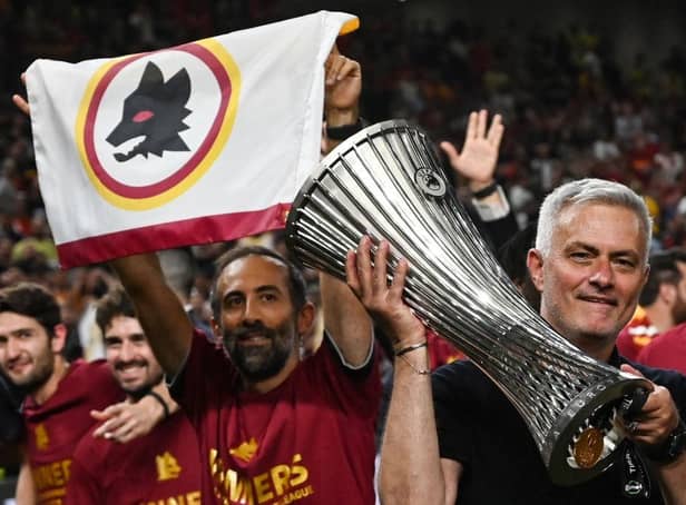 <p>Roma's head coach Jose Mourinho celebrates with the trophy after his team won the UEFA Europa Conference League final against Feyenoord at the Air Albania Stadium in Tirana on May 25, 2022. (Photo by OZAN KOSE / AFP) (Photo by OZAN KOSE/AFP via Getty Images)</p>