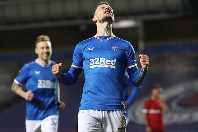 Borna Barisic celebrates after he scores his team's fourth goal during the UEFA Europa League Round of 32 match between Rangers FC and Royal Antwerp FC at  on February 25, 2021 (Photo by Ian MacNicol/Getty Images)