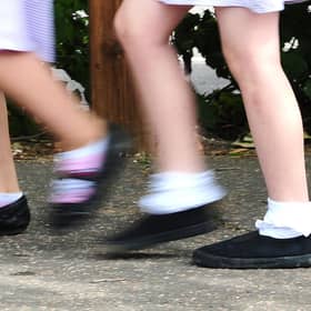 A generic stock photo of school girls walking to school.