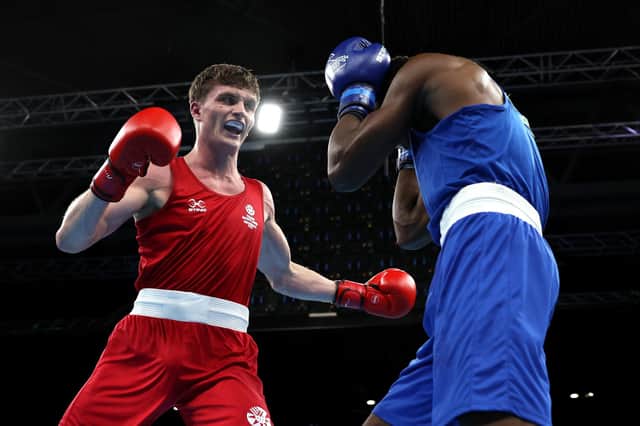 <p>Sam Hickey (red) of Scotland enroute to victory over Adeyinka Benson (blue) of Nigeria during the Men’s Boxing Over 71kg-75kg Middleweight Quarter-Final match on day six of the Birmingham 2022 Commonwealth Games. (Photo by Eddie Keogh/Getty Images)</p>