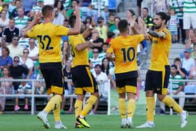 SPOT ON: Ruben Neves, right, celebrates with his Wolves team mates after firing his side in front through a first-half penalty in Saturday evening's pre-season friendly against Sporting Lisbon in Faro. Photo by Gualter Fatia/Getty Images.